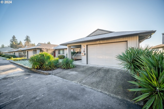 single story home with a garage