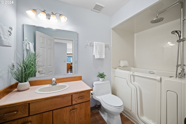 full bathroom featuring separate shower and tub, hardwood / wood-style flooring, vanity, and toilet