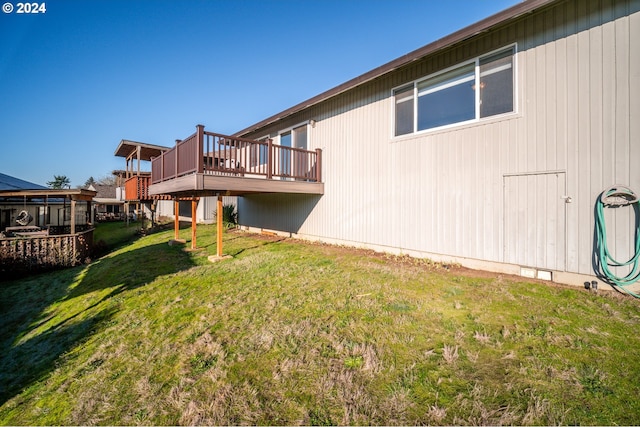 1205 NW 132nd St Unit B, Vancouver, WA 98685 - rear view of house with a deck and a lawn