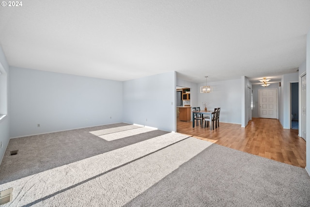 1205 NW 132nd St Unit B, Vancouver, WA 98685 - carpeted living room with a chandelier