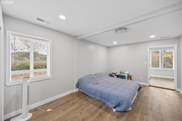 bedroom with hardwood / wood-style floors