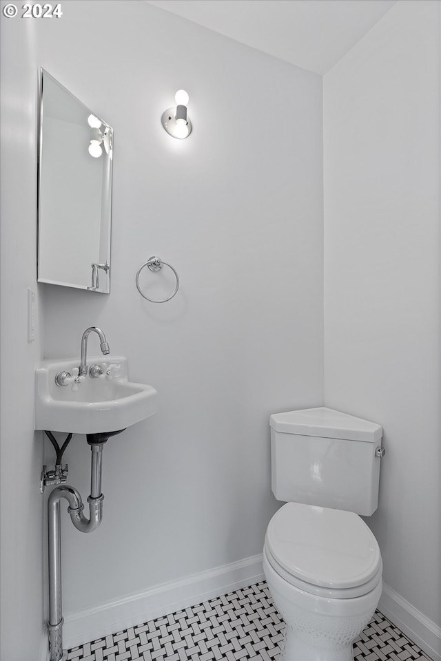 bathroom with tile patterned floors and toilet