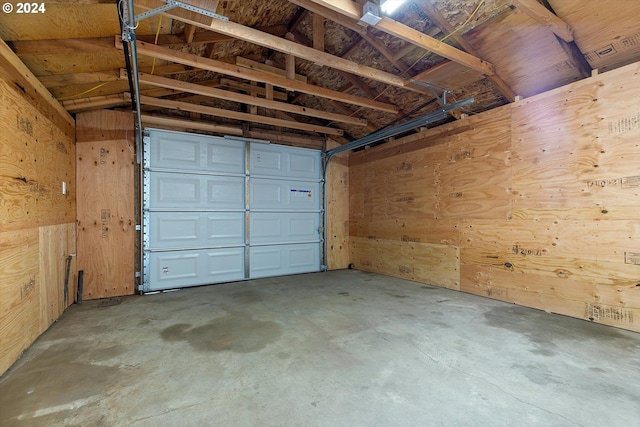 garage featuring wooden walls