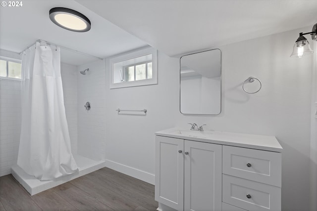 bathroom with vanity, hardwood / wood-style floors, and a shower with curtain