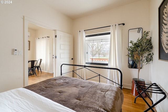 bedroom with wood-type flooring