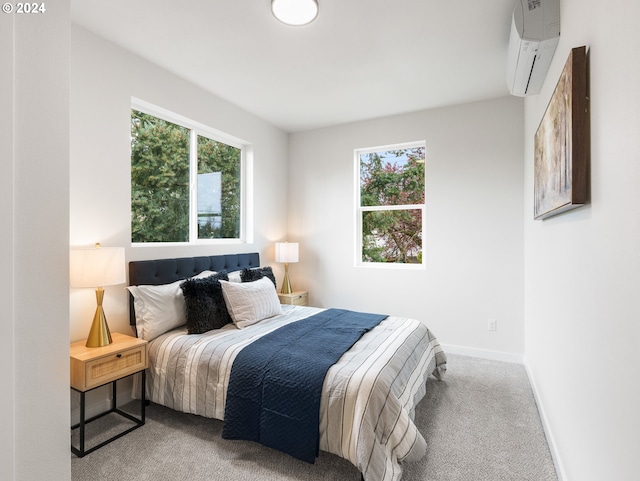 carpeted bedroom featuring multiple windows and a wall unit AC