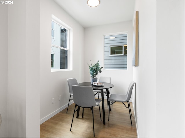 dining area with light hardwood / wood-style flooring