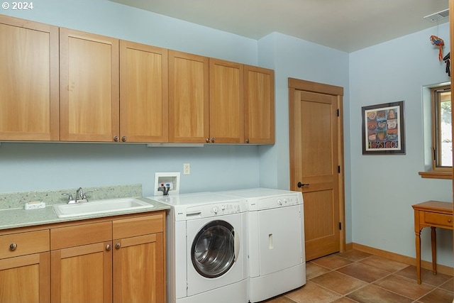 17252 N Applegate Rd, Grants Pass, OR 97527 - laundry room featuring cabinet space, washer and dryer, light tile patterned floors, and baseboards