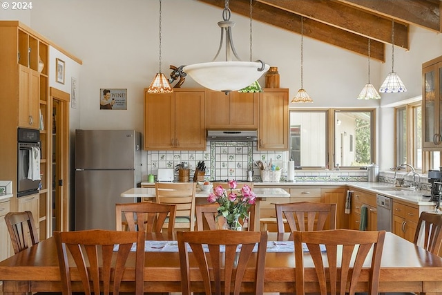 17252 N Applegate Rd, Grants Pass, OR 97527 - kitchen with appliances with stainless steel finishes, high vaulted ceiling, tasteful backsplash, under cabinet range hood, and beamed ceiling