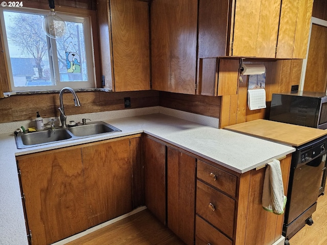 kitchen featuring hardwood / wood-style flooring and sink