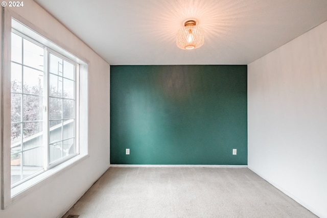 empty room with light colored carpet