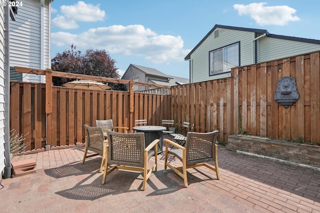 view of patio / terrace with an outdoor fire pit