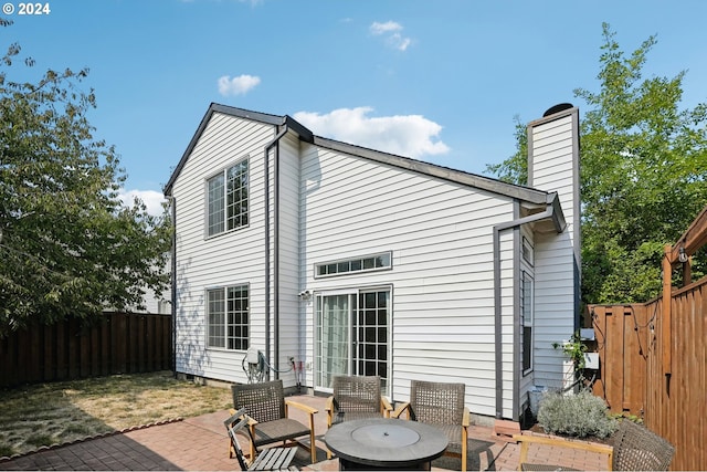 back of property featuring a patio