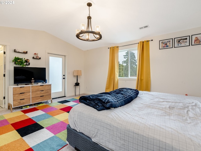 bedroom with an inviting chandelier and lofted ceiling