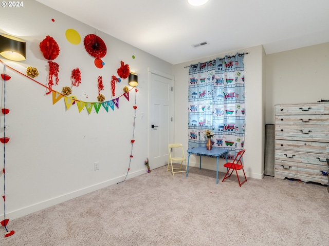 recreation room with carpet floors