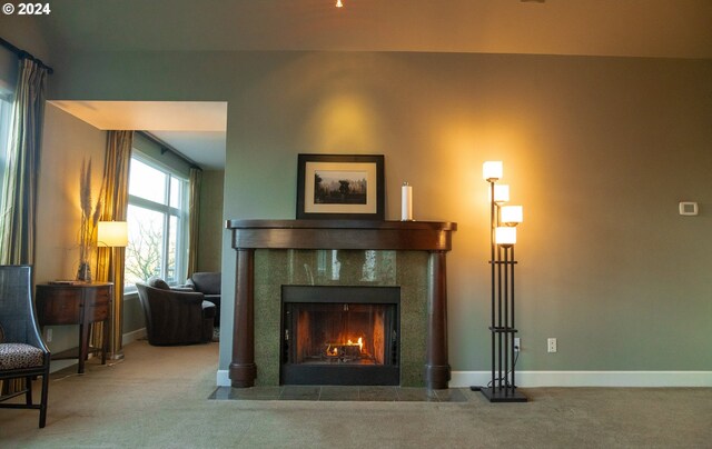 living area with carpet flooring and a fireplace