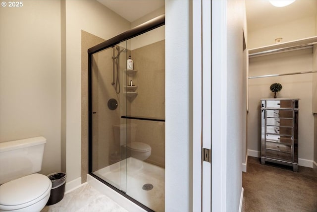 225 S Montgomery St Unit G10, Portland, OR 97201 - bathroom with toilet, a shower stall, and baseboards