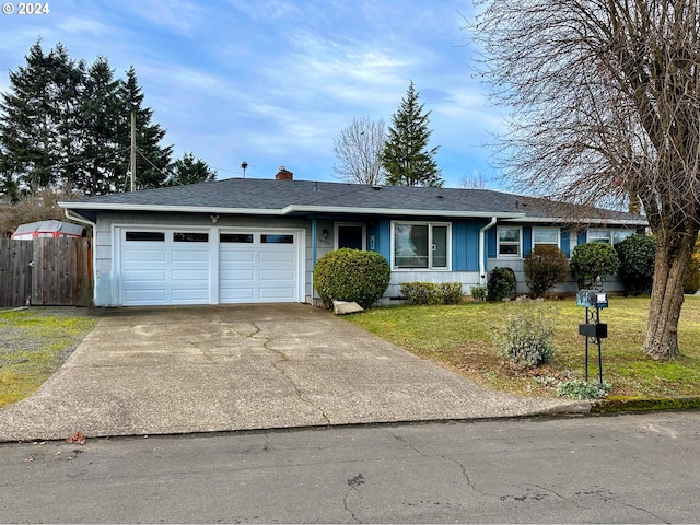 ranch-style house with a garage and a front yard