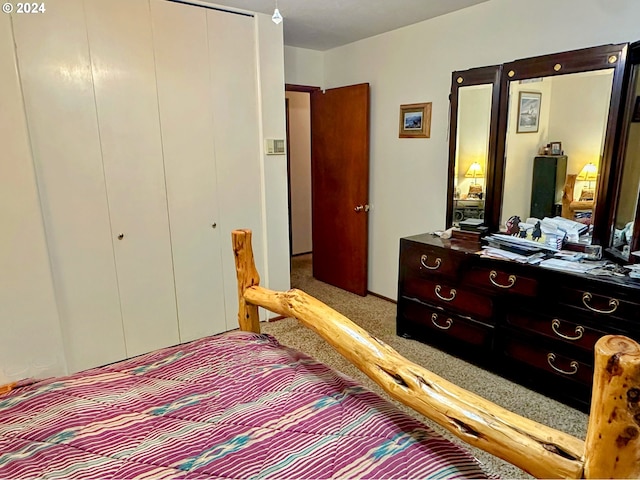 carpeted bedroom with a closet