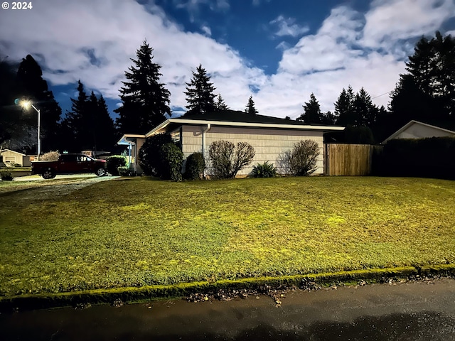 view of home's exterior featuring a lawn