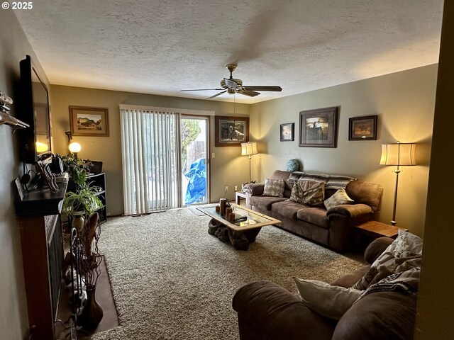 living room featuring ceiling fan and carpet