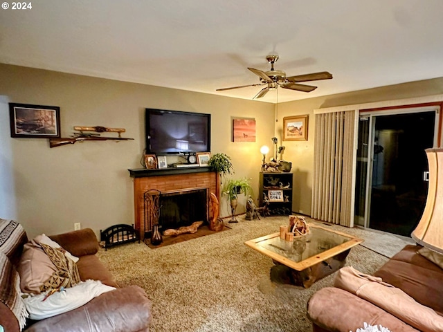 carpeted living room with ceiling fan