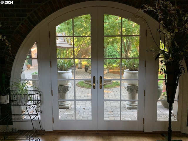 doorway featuring light hardwood / wood-style floors and french doors