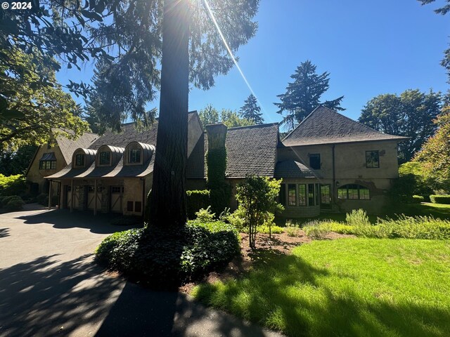 view of home's exterior with a yard