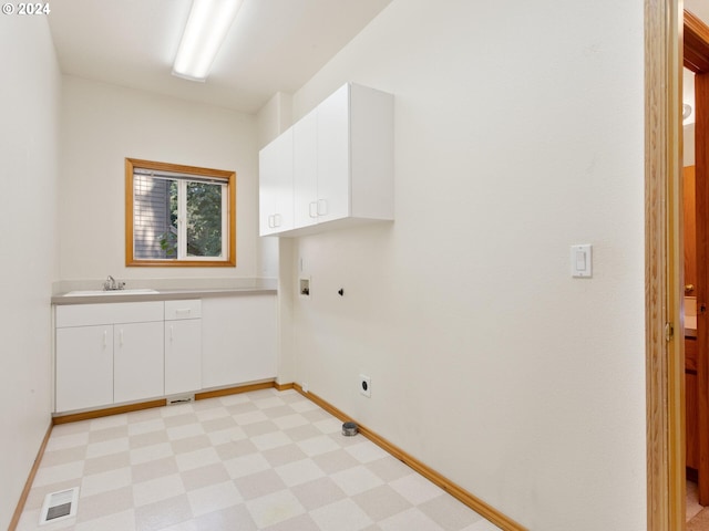 clothes washing area featuring hookup for a washing machine, cabinets, electric dryer hookup, and sink