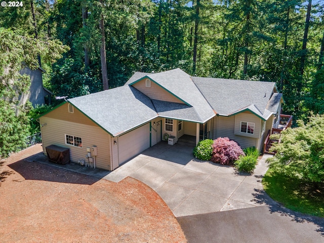 27580 SW Canyon Creek Rd, Wilsonville, OR 97070 - view of front facade with concrete driveway, a shingled roof, and a garage