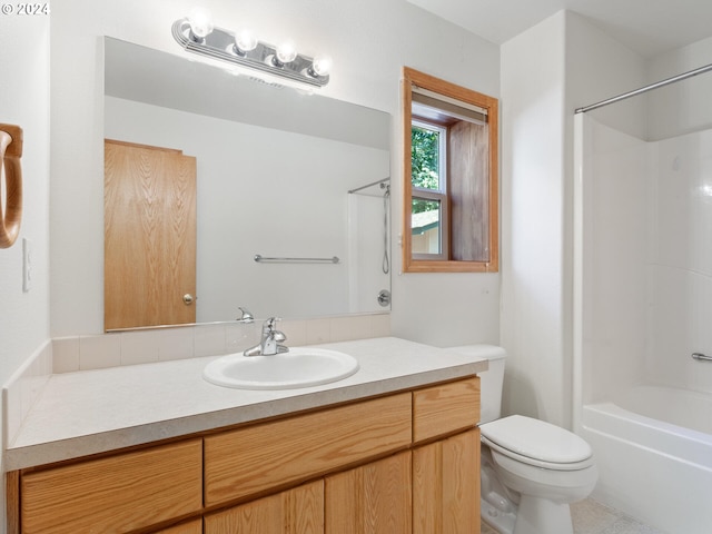 full bathroom with bathtub / shower combination, toilet, and vanity