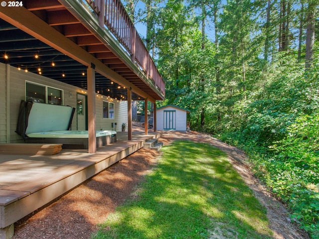 view of yard with a wooden deck and a storage unit