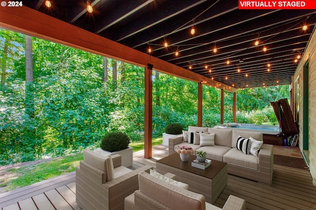 wooden terrace with an outdoor hangout area