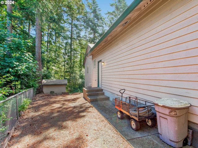 view of patio / terrace featuring a storage shed