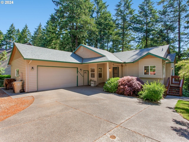 27580 SW Canyon Creek Rd, Wilsonville, OR 97070 - ranch-style house with an attached garage, concrete driveway, and roof with shingles
