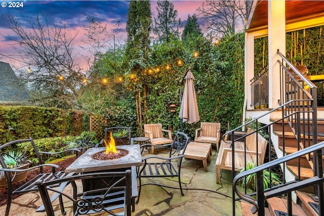 patio terrace at dusk with an outdoor fire pit