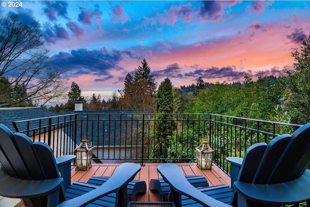 view of balcony at dusk