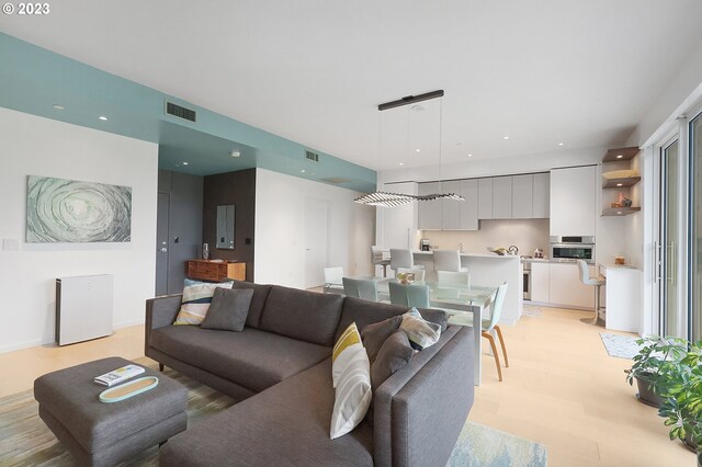 1150 NW Quimby St Unit 436, Portland, OR 97209 - living area featuring light wood-style floors and recessed lighting