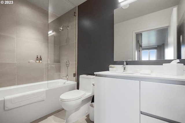 full bathroom featuring toilet, vanity, and tiled shower / bath