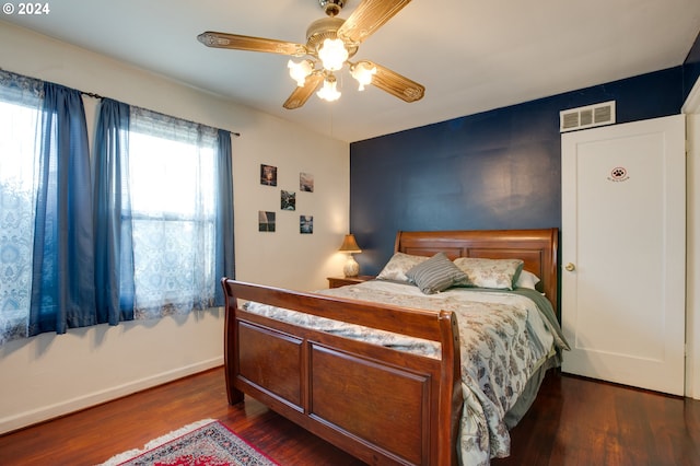 bedroom featuring dark wood-type flooring and ceiling fan