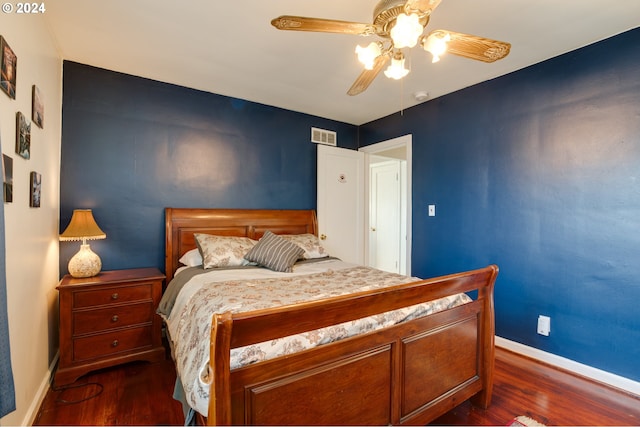 bedroom with ceiling fan and dark wood-type flooring