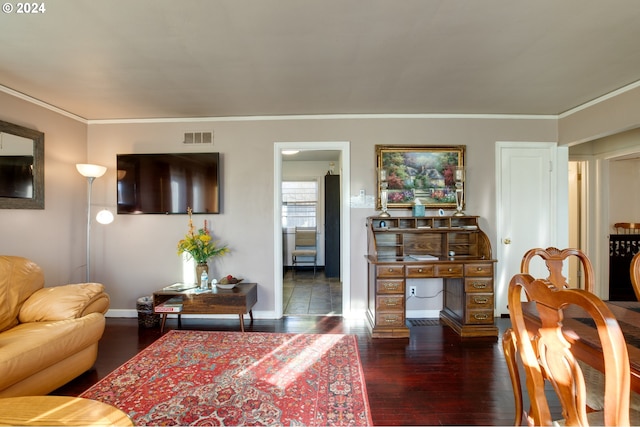 living room with dark hardwood / wood-style floors and ornamental molding