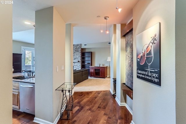 hallway with sink and dark wood-type flooring