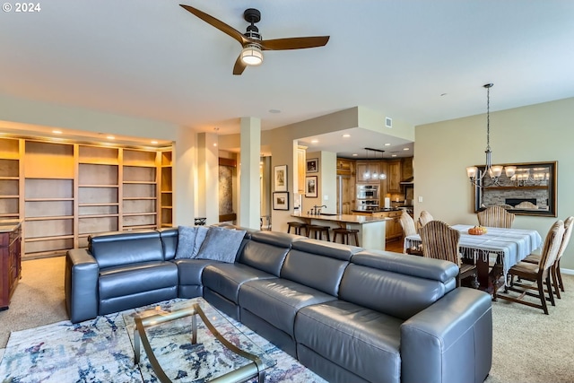 11529 SE Bateleur Way Unit C8, Happy Valley, OR 97086 - living area with light carpet, a chandelier, a ceiling fan, and recessed lighting