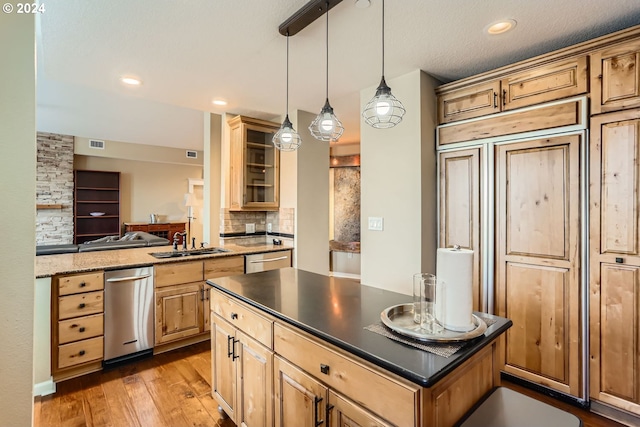 11529 SE Bateleur Way Unit C8, Happy Valley, OR 97086 - kitchen featuring a sink, dishwasher, hardwood / wood-style floors, backsplash, and hanging light fixtures