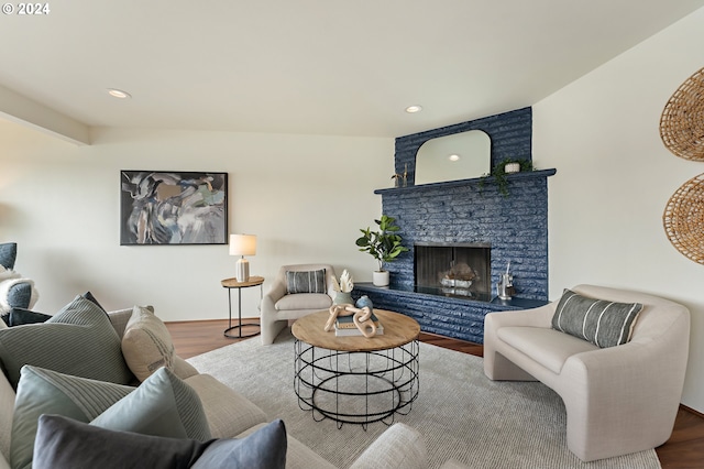 living room featuring hardwood / wood-style flooring and a fireplace