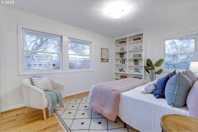 bedroom with light hardwood / wood-style flooring