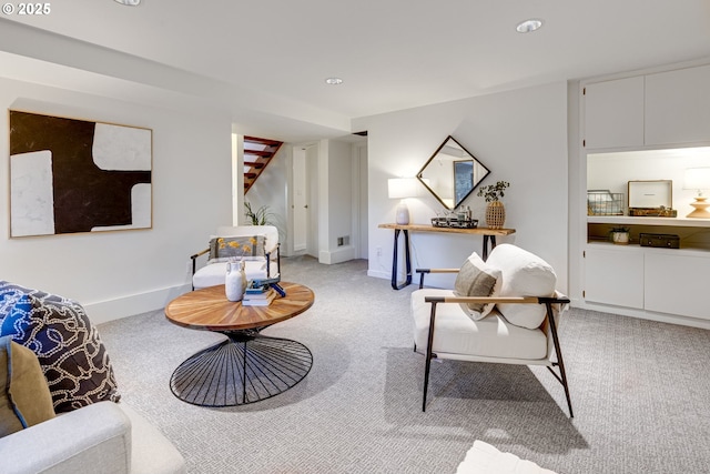 sitting room featuring carpet