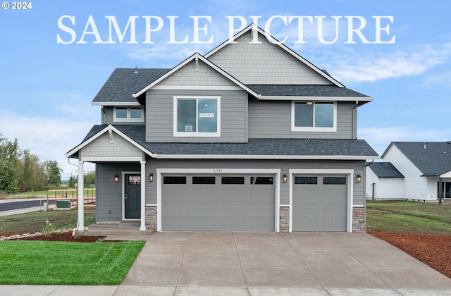 craftsman-style home with a front yard and a garage