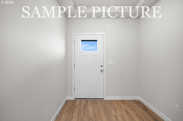 doorway to outside with hardwood / wood-style floors